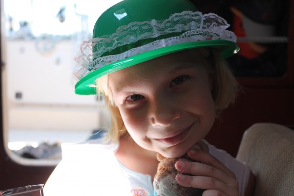 Lily with new hair cut under St Patty hat which she wears everywhere now