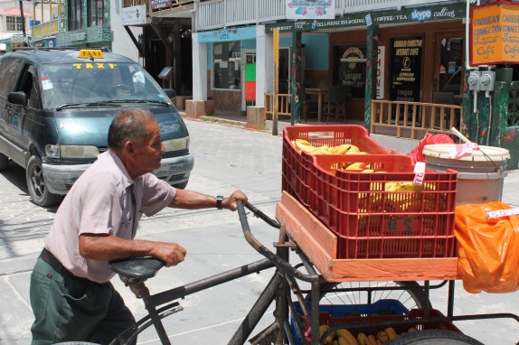 Banana vendor headed to his spot at Fruita Landia