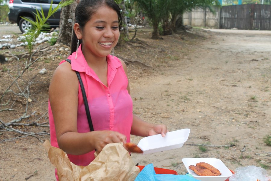 These empanadas are mucho sabor. They are served with a small serving of cabbage and mayo ensalada on top.