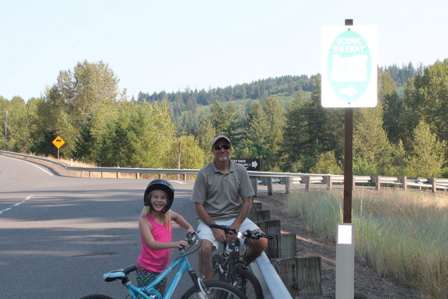 Randall and Lily at a biking trailhead south of Estacada on the Clackamas River. We made it only a mile on this trail before the heat got to us. We thought there would be places to get in the river but it was too overgrown along this section.